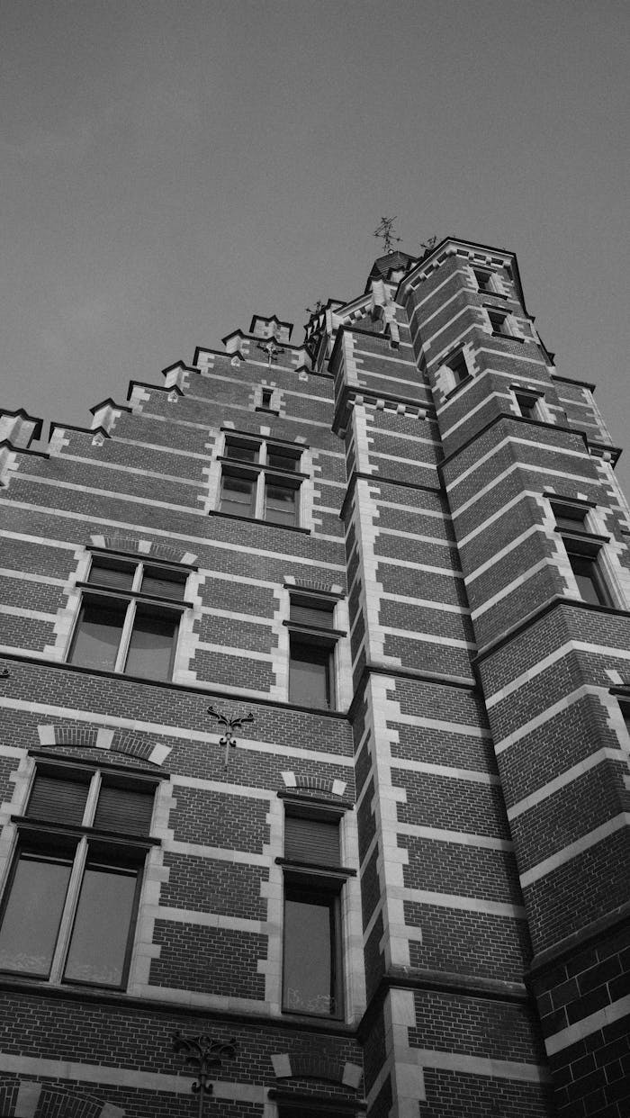 Black and white photo capturing the intricate design of a historic building in Hasselt, Belgium.